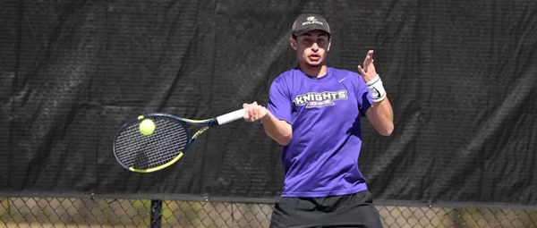 Knights men's tennis player hits the ball during a match. 